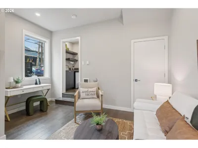 Townhome living area staged with a writing desk, bench and round coffee table
